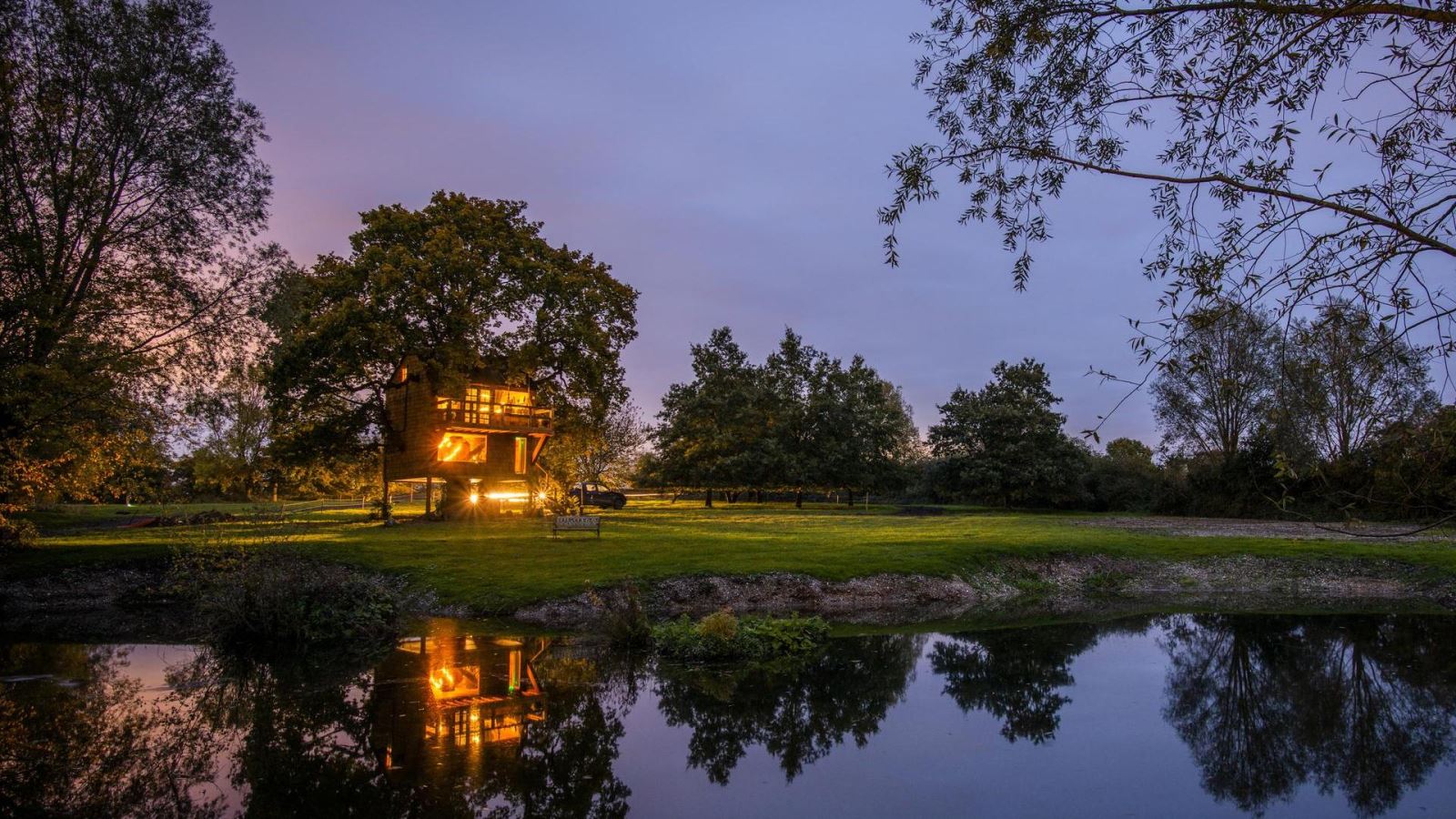 The Old Oak treehouse at night